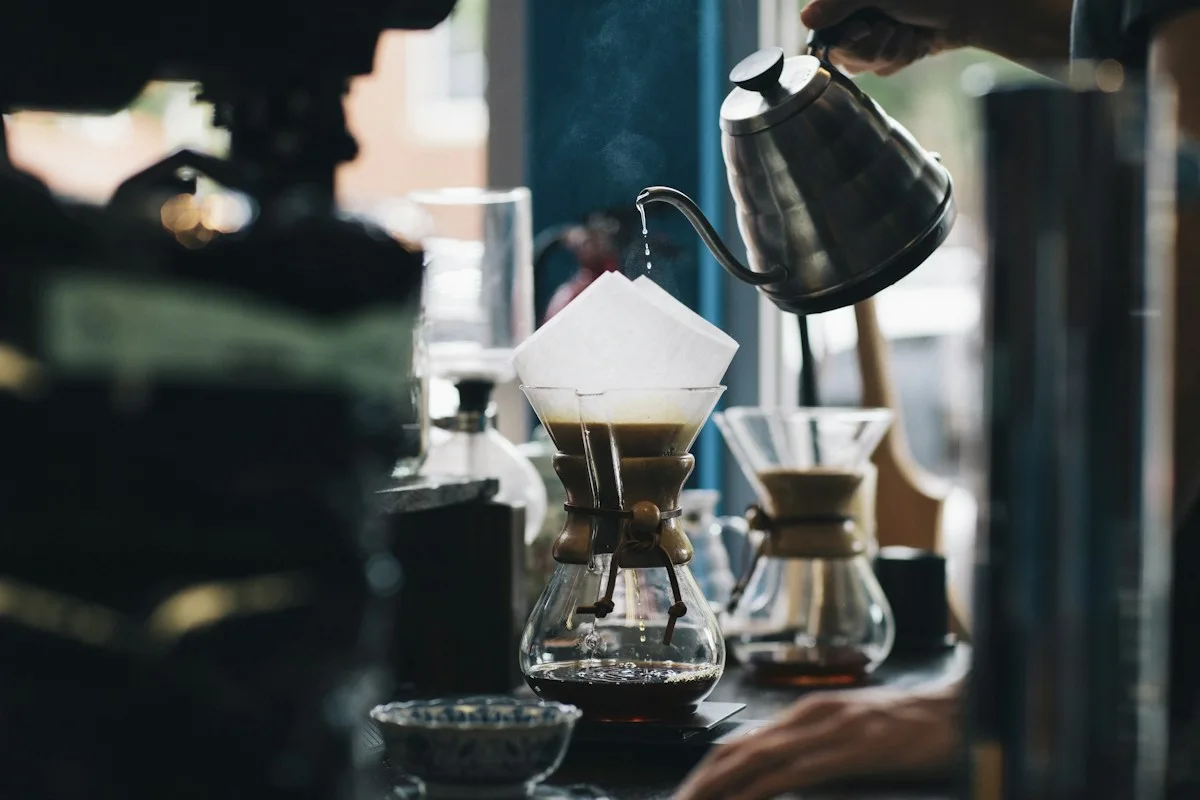 Pour-over coffee prepared with a black gooseneck kettle