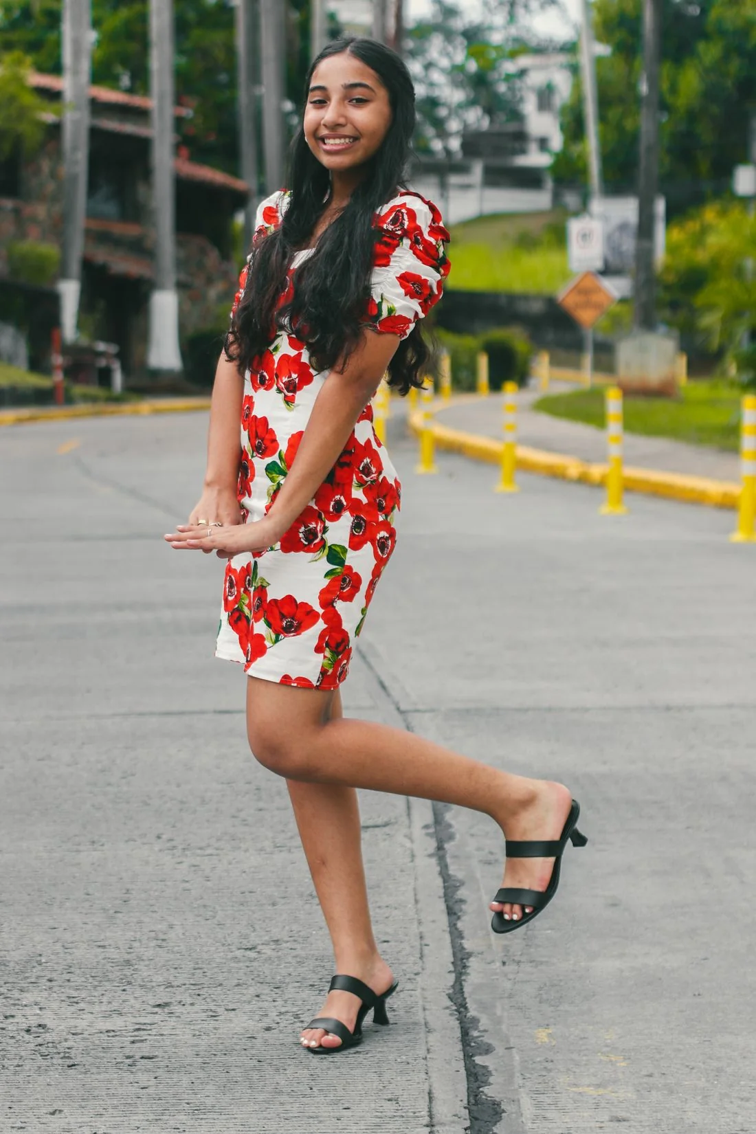 Woman in a floral dress on a city street